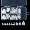 A clear plastic organizer case filled with white silicone nail tips in various shapes and sizes, with a row of matching white silicone nail tips aligned below on a black background.