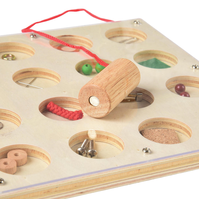 Wooden puzzle with various shapes and a red string on a white background