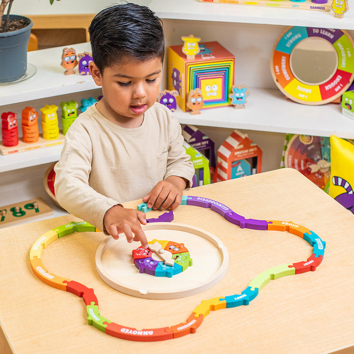 Child playing with a colorful wooden toy in a playroom.